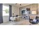 Stylish home office featuring a modern desk, brick accent wall, and contemporary decor for productivity at 10421 Gentle Rain Dr, Land O Lakes, FL 34638