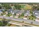 Birds eye view of the neighborhood highlighting houses with well-kept yards, sidewalks, and a nearby community park at 10625 Cardera Dr, Riverview, FL 33578