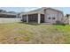Spacious backyard with a screened-in patio offers a private outdoor space at 10625 Cardera Dr, Riverview, FL 33578