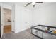 Bedroom with gray carpet, neutral walls, a closet, and a play area at 10625 Cardera Dr, Riverview, FL 33578