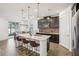 Kitchen island with granite countertops, seating and views to the dining area at 10625 Cardera Dr, Riverview, FL 33578