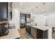 Kitchen with stainless steel appliances, granite countertops, dark wood cabinets, and pendant lighting at 10625 Cardera Dr, Riverview, FL 33578