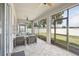 Relaxing screened-in lanai with comfortable seating and views of the backyard at 10625 Cardera Dr, Riverview, FL 33578
