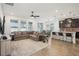Open concept space seamlessly integrates the living room, dining area, and kitchen with sleek breakfast bar at 10625 Cardera Dr, Riverview, FL 33578