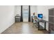 Office space with a desk, computer, and filing cabinets with wood-look tile flooring at 10625 Cardera Dr, Riverview, FL 33578