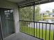Balcony view overlooking a serene pond with surrounding lush greenery and community buildings at 11201 122Nd Ave # 126, Largo, FL 33778