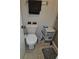 Compact bathroom featuring a toilet, a cabinet and a functional sink with a neutral-colored floor at 11201 122Nd Ave # 126, Largo, FL 33778