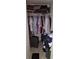 A tidy closet with clothes hanging on a rod and storage for luggage and other personal items at 11201 122Nd Ave # 126, Largo, FL 33778