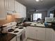 Functional kitchen showcasing white cabinets, modern appliances, and plenty of counter space at 11201 122Nd Ave # 126, Largo, FL 33778
