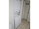 A laundry area featuring a stacked washer and dryer, maximizing space and functionality at 11201 122Nd Ave # 126, Largo, FL 33778