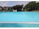 A pristine community pool overlooking a serene pond adds to the property's appeal at 11201 122Nd Ave # 126, Largo, FL 33778
