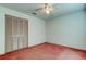 Cozy bedroom featuring a ceiling fan and a spacious closet for ample storage at 11325 Glenmont Dr, Tampa, FL 33635