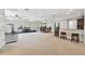 Spacious finished basement features a bar, lounge area, workout area, and neutral decor at 11624 Calf Path Dr, Tampa, FL 33626