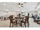 Finished basement with eating area, bar and workout space with modern ceiling fans at 11624 Calf Path Dr, Tampa, FL 33626