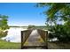 Wooden dock offering picturesque views of the serene lake at 11624 Calf Path Dr, Tampa, FL 33626
