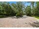 Elegant brick entrance to the community surrounded by lush greenery and a secure gate at 11624 Calf Path Dr, Tampa, FL 33626