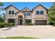 Stately home with a three-car garage, beautiful landscaping and a paver driveway, exuding curb appeal at 11624 Calf Path Dr, Tampa, FL 33626