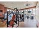 Bright fitness center equipped with modern weight machines, treadmills, and ample natural light from large windows at 11624 Calf Path Dr, Tampa, FL 33626