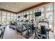 Well-equipped gym featuring modern treadmills, exercise bikes, and weight machines, bathed in natural light at 11624 Calf Path Dr, Tampa, FL 33626
