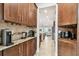 Butler's pantry boasts custom cabinets, granite countertops, and multiple coffee stations for added convenience at 11624 Calf Path Dr, Tampa, FL 33626