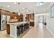 Spacious kitchen features granite countertops, stainless steel appliances and a large island with seating at 11624 Calf Path Dr, Tampa, FL 33626