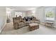 Living room area has comfortable seating, accent lighting and soft carpet at 11624 Calf Path Dr, Tampa, FL 33626
