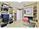 Custom storage space with lots of shelving, workspace and bright lighting at 11624 Calf Path Dr, Tampa, FL 33626