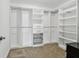 Spacious walk-in closet with custom shelving, drawers, and ample storage space at 11624 Calf Path Dr, Tampa, FL 33626