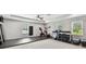 Bright workout area with exercise equipment, weights, rubber flooring, and natural light at 11624 Calf Path Dr, Tampa, FL 33626