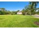 Expansive, well-maintained lawn and landscaping surrounding the home at 11624 Calf Path Dr, Tampa, FL 33626