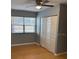 Cozy bedroom featuring a ceiling fan, a window for natural light, and a closet at 12230 Skyler Ln, Spring Hill, FL 34609