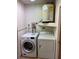 Laundry room featuring a modern washer and dryer, ensuring convenience for household tasks at 12230 Skyler Ln, Spring Hill, FL 34609