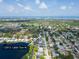A beautiful aerial view shows the neighborhood, pond, golf course, and the location of the home at 12913 126Th Ter, Largo, FL 33774
