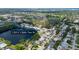 A beautiful aerial view shows the neighborhood, pond, golf course, and the location of the home at 12913 126Th Ter, Largo, FL 33774