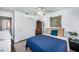Cozy bedroom featuring a classic hutch and a blue comforter, with natural light at 12913 126Th Ter, Largo, FL 33774