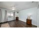 Charming bedroom with hardwood floors, a ceiling fan, and natural light from the window at 12913 126Th Ter, Largo, FL 33774