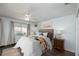 Bright bedroom featuring a ceiling fan, a decorative window, and a wood floor at 12913 126Th Ter, Largo, FL 33774