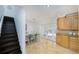 Bright dining room with tile flooring, a table with six chairs, and access to outside at 12913 126Th Ter, Largo, FL 33774