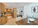 Bright kitchen with wooden cabinets with access to both the living room and the dining room at 12913 126Th Ter, Largo, FL 33774