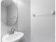 Clean and simple half-bath with a modern sink and mirror at 13174 Royal Pines Ave, Riverview, FL 33579