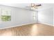Bright, spacious bedroom featuring wood flooring and large windows at 13174 Royal Pines Ave, Riverview, FL 33579