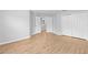 Bedroom with light wood floors, white doors and neutral walls at 13174 Royal Pines Ave, Riverview, FL 33579
