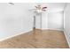 Bright bedroom with wood-look floors, neutral paint, and ample natural light at 13174 Royal Pines Ave, Riverview, FL 33579