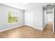 Modern bedroom with bright window, closet, and stylish flooring at 13174 Royal Pines Ave, Riverview, FL 33579