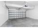 A spacious garage with a white door and concrete floor at 13174 Royal Pines Ave, Riverview, FL 33579