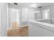 Hallway featuring modern wood-look flooring and neutral tones at 13174 Royal Pines Ave, Riverview, FL 33579