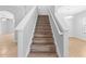Staircase with wood treads and white risers and banisters at 13174 Royal Pines Ave, Riverview, FL 33579