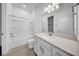 Bright bathroom featuring a shower-tub combination, a white vanity with quartz countertop and updated fixtures at 13855 Sharp Hawk Dr, Riverview, FL 33569