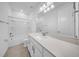 Bright bathroom featuring a shower-tub combination, a vanity with quartz countertop and updated fixtures at 13855 Sharp Hawk Dr, Riverview, FL 33569