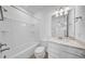Full bathroom showcases shower and tub combination with modern vanity at 13855 Sharp Hawk Dr, Riverview, FL 33569